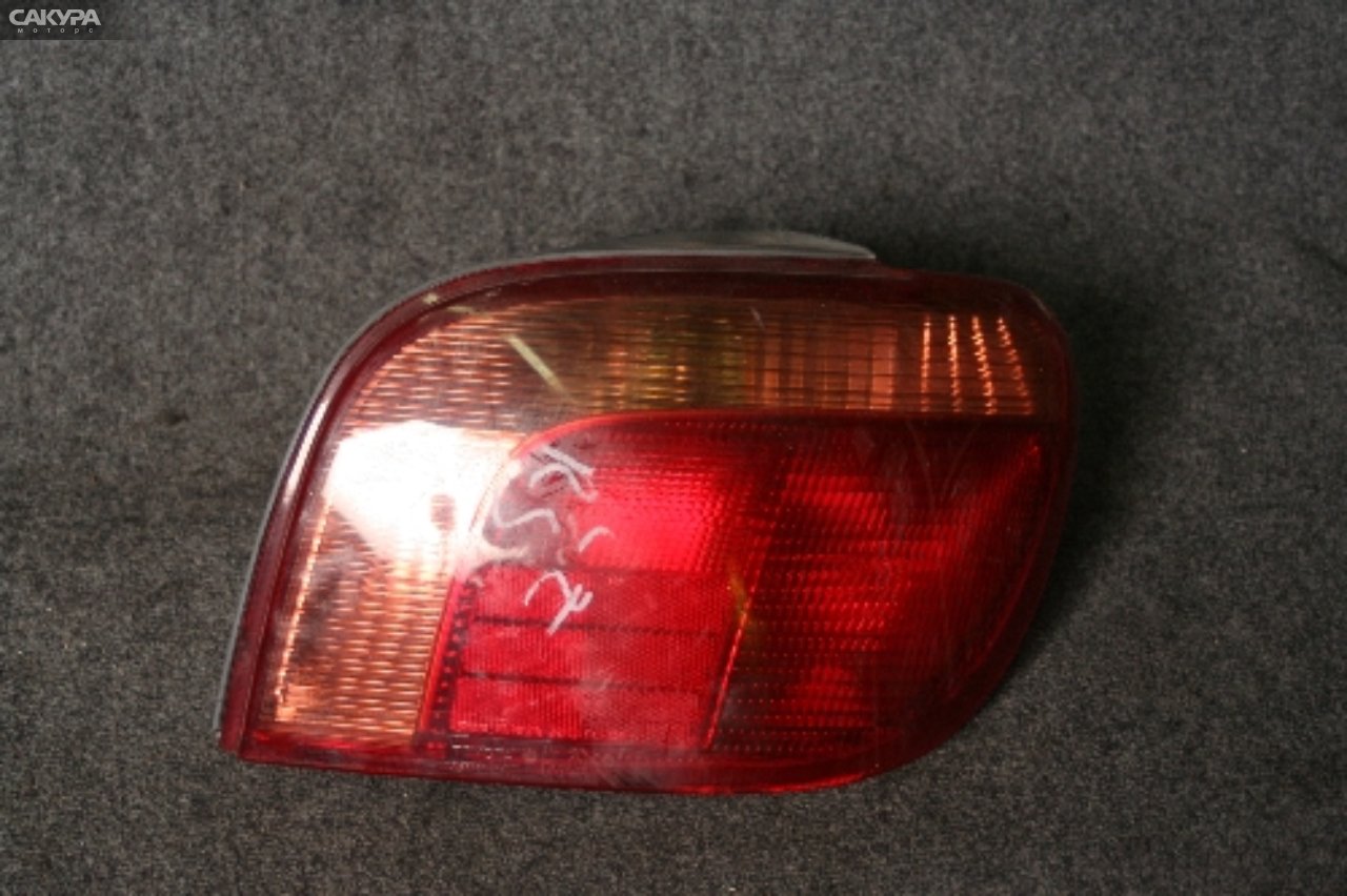 Фонарь стоп-сигнала правый Toyota Vitz SCP13 2SZ-FE 52-041: купить в Сакура Красноярск.