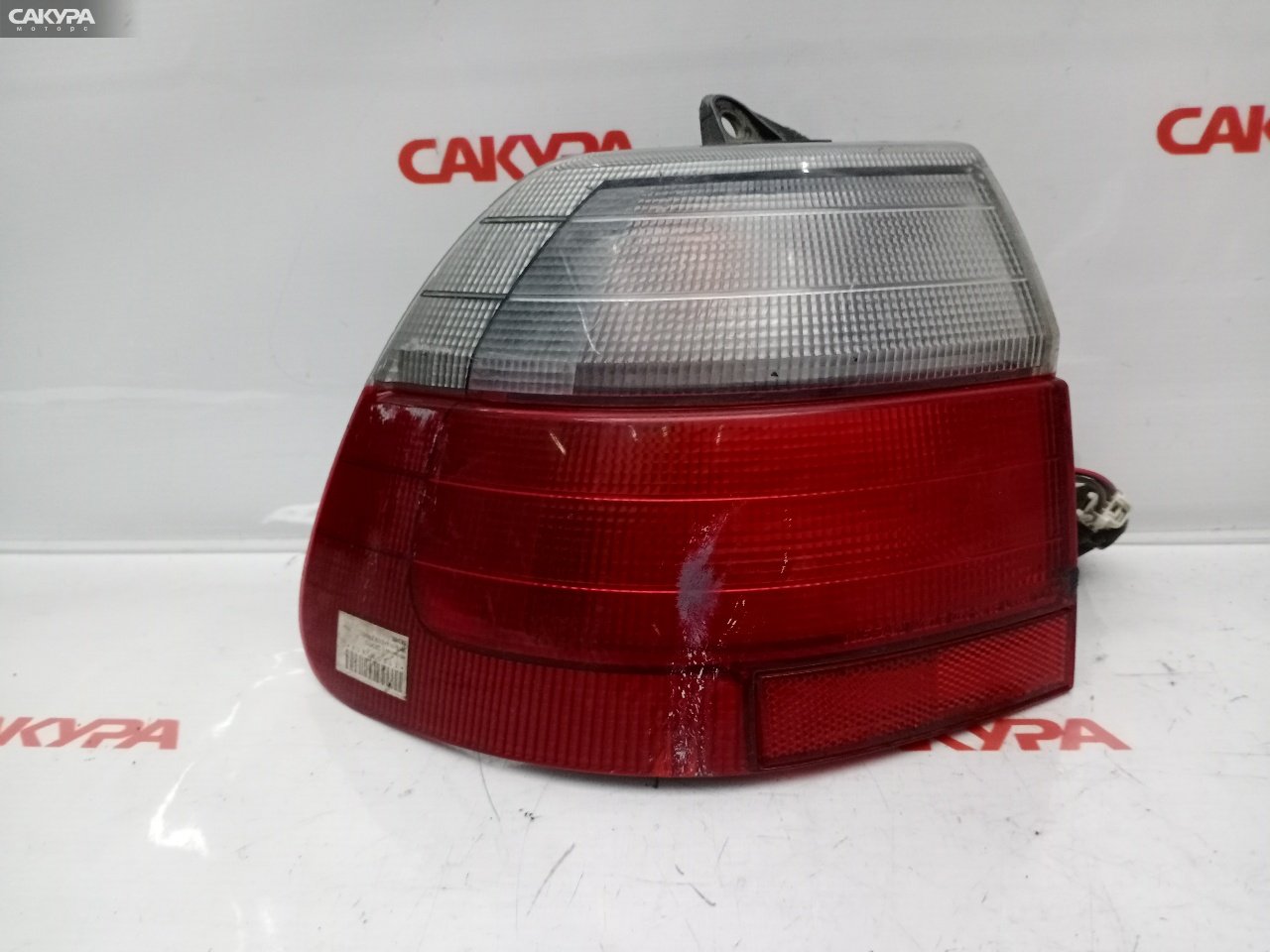 Фонарь стоп-сигнала левый Nissan Avenir PNW10 220-24703: купить в Сакура Красноярск.