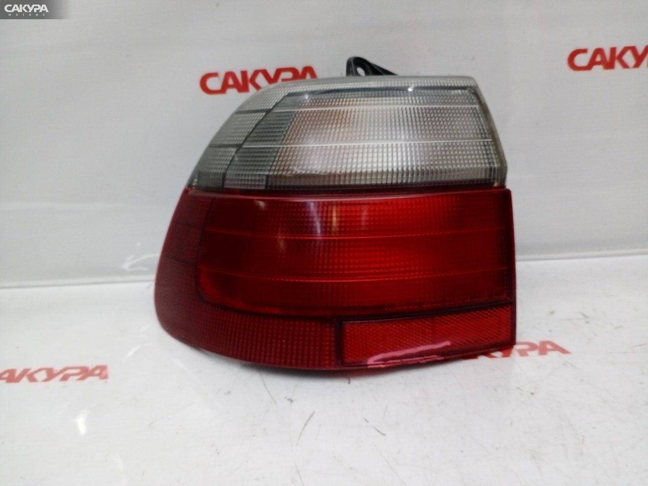 Фонарь стоп-сигнала левый Nissan Avenir SW10 CD20-T 220-24703: купить в Сакура Красноярск.