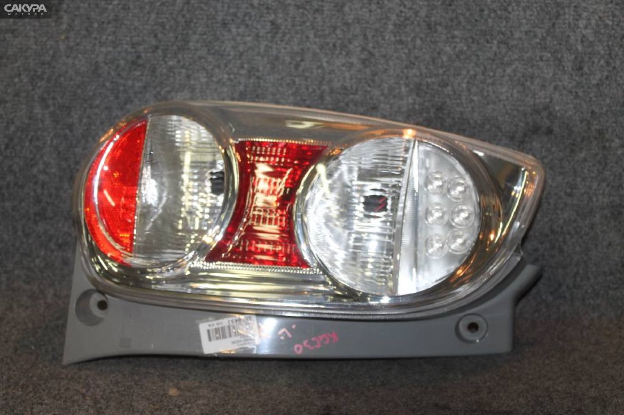 Фонарь стоп-сигнала левый Toyota Passo KGC30 220-51004: купить в Сакура Красноярск.