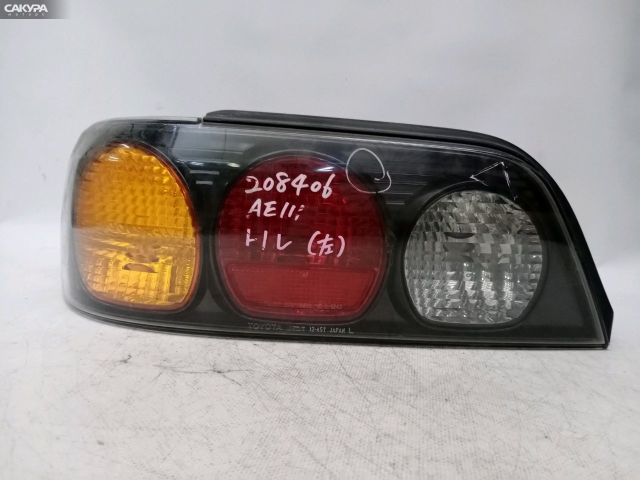 Фонарь стоп-сигнала левый Toyota Corolla Levin AE111 12-457: купить в Сакура Красноярск.