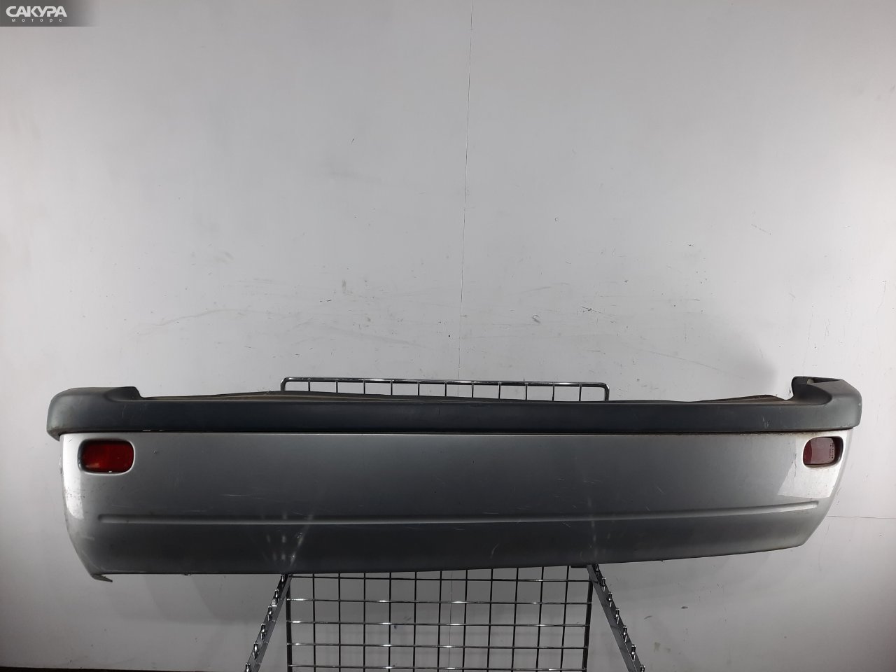 Бампер задний Toyota Raum EXZ10 5E-FE: купить в Сакура Красноярск.