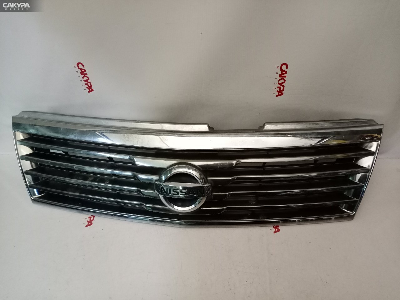 Решетка радиатора Nissan Liberty RM12 QR20DE: купить в Сакура Красноярск.