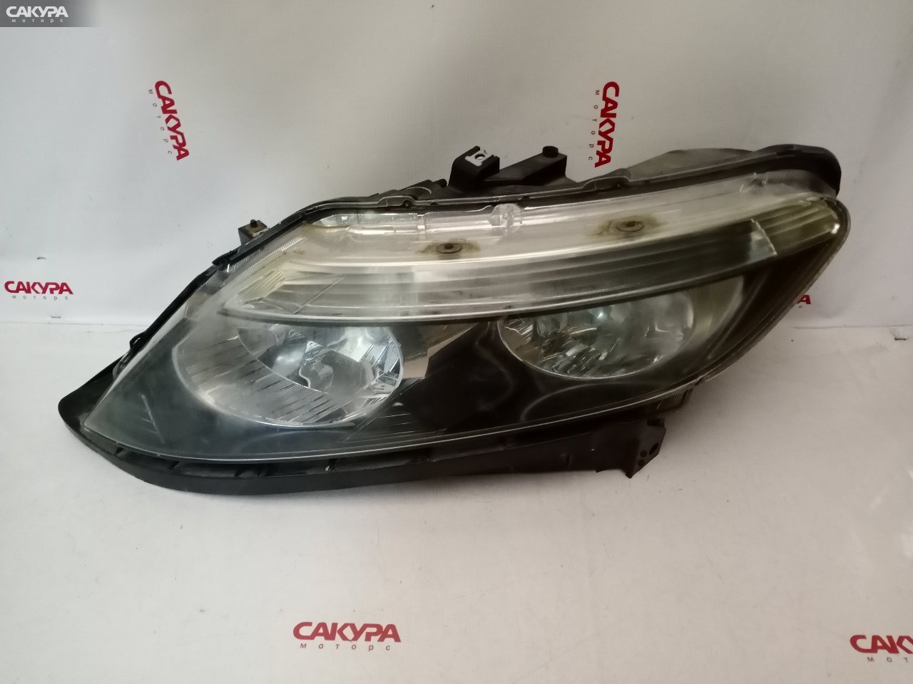 Фара левая Honda Partner GJ3 100-22591: купить в Сакура Красноярск.