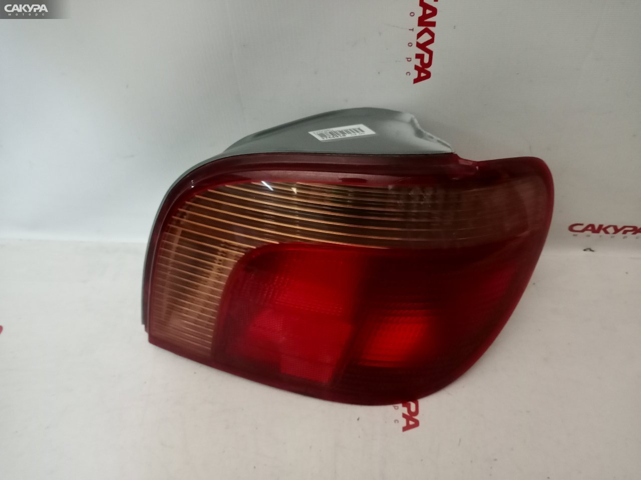 Фонарь стоп-сигнала правый Toyota Vitz SCP13 2SZ-FE 52-041: купить в Сакура Красноярск.