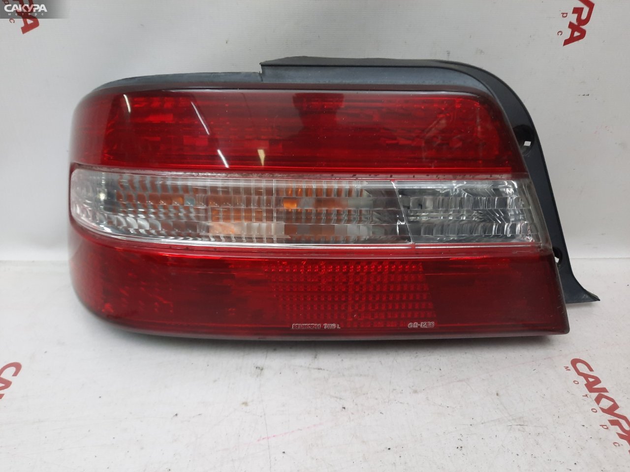 Фонарь стоп-сигнала левый Toyota Chaser GX100 22-254: купить в Сакура Красноярск.