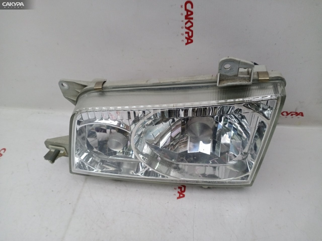 Фара левая Mazda Titan SYE6T 100-61569: купить в Сакура Красноярск.