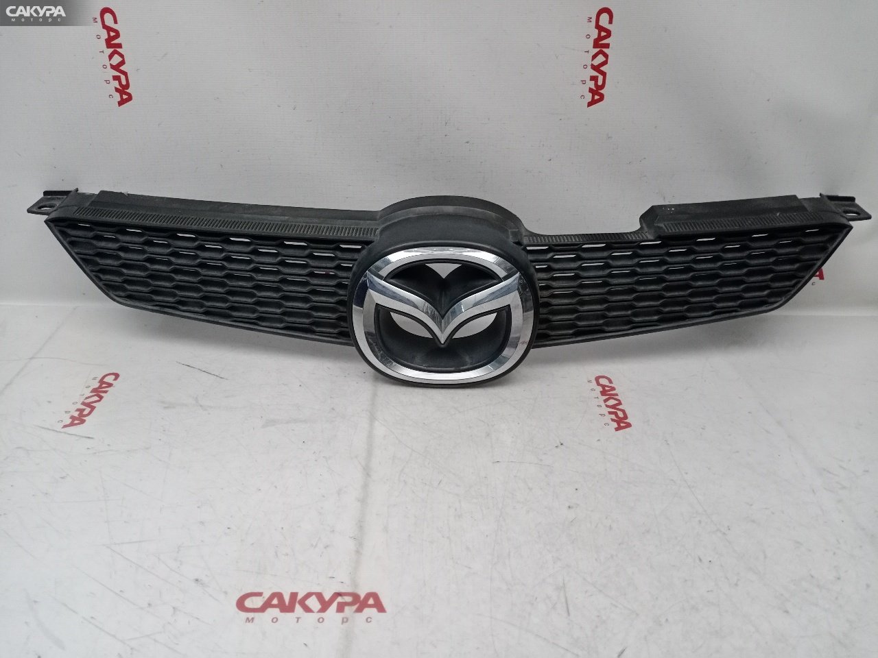 Решетка радиатора Mazda Demio DY3W ZJ-VE: купить в Сакура Красноярск.