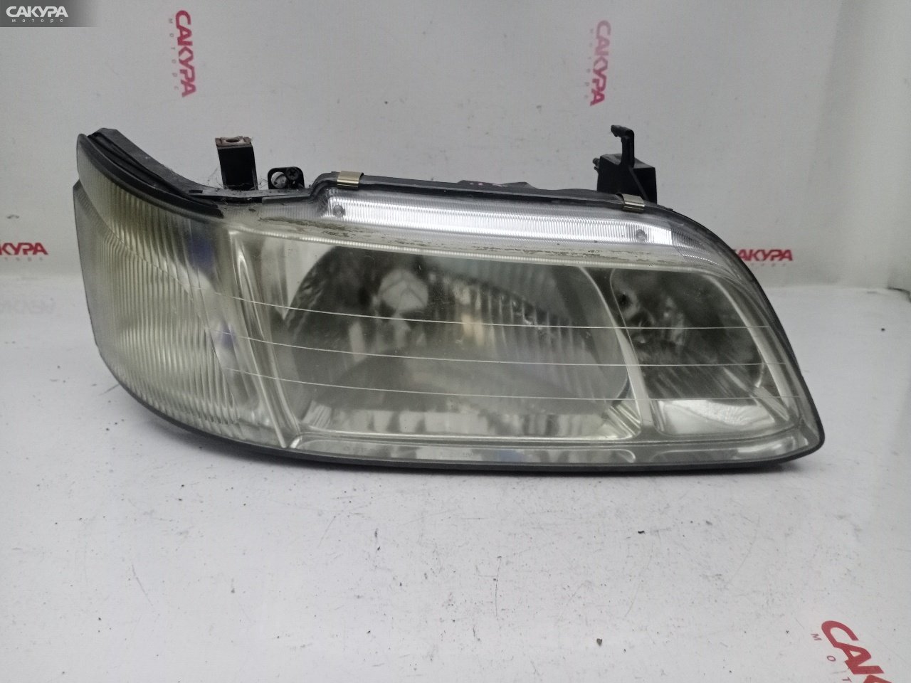 Фара правая Nissan Laurel HC35 RB20DE 100-66255: купить в Сакура Красноярск.
