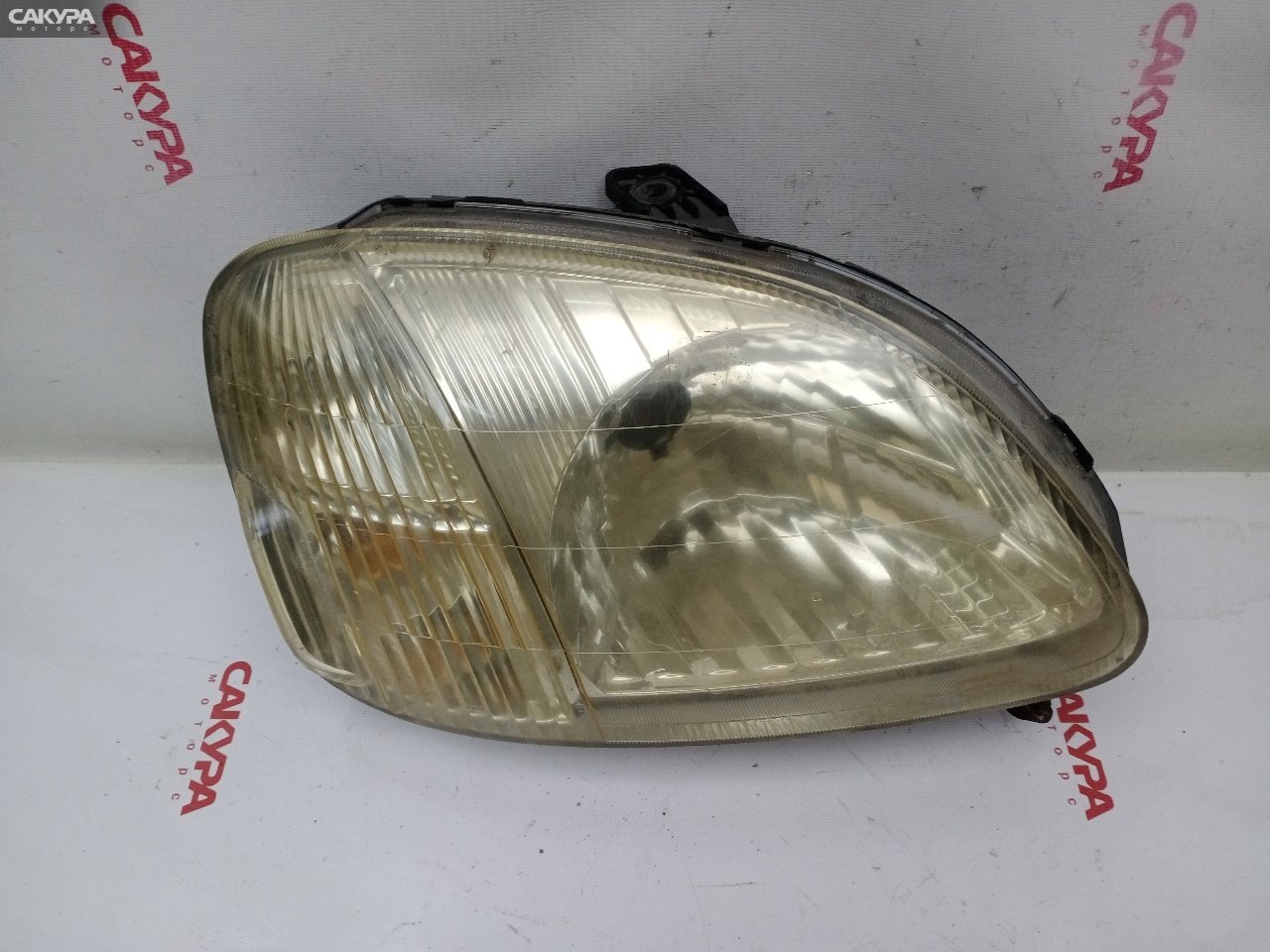 Фара правая Honda Logo GA3 P0151: купить в Сакура Красноярск.