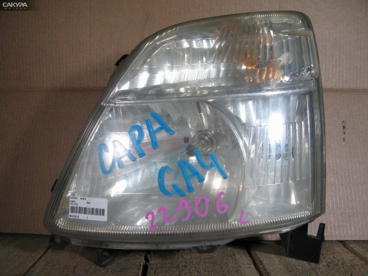 Фара левая Honda Capa GA4 100-22306: купить в Сакура Абакан.