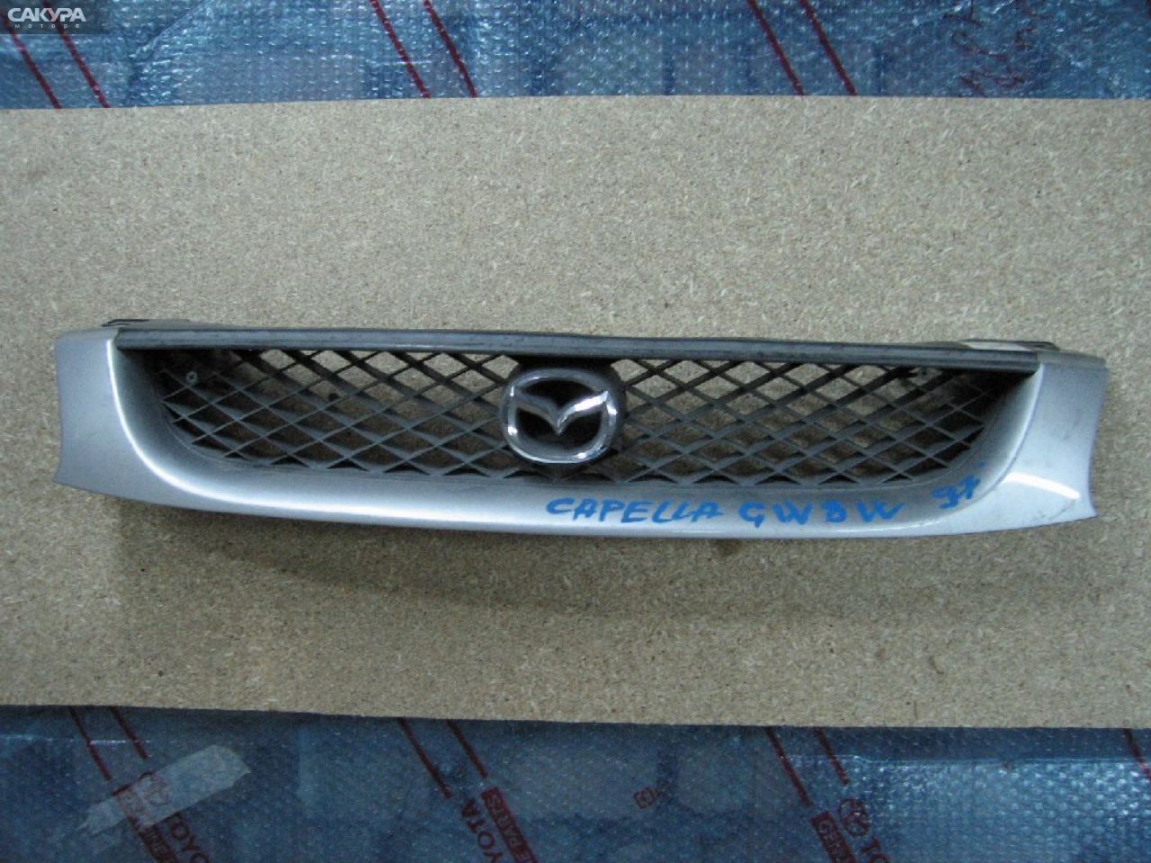 Решетка радиатора Mazda Capella GW8W: купить в Сакура Абакан.