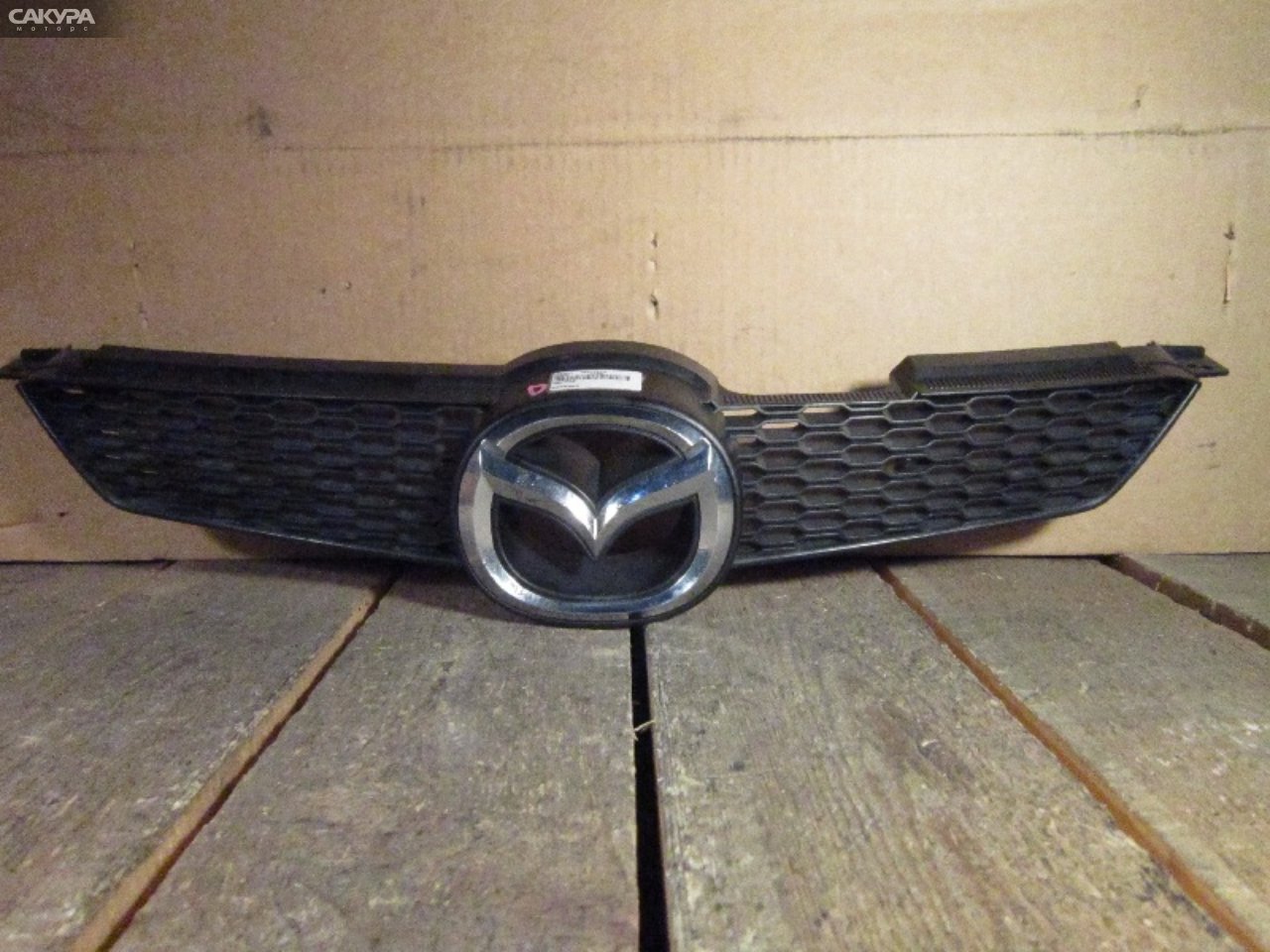 Решетка радиатора Mazda Demio DY3W: купить в Сакура Абакан.